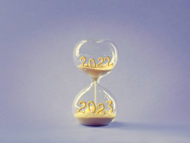 End of the year 2022, Silverster, Happy New Year 2023.Hourglass in wooden hand model on light purple paper. Hourglass is also known as sandglass, sand timer or sand clock.