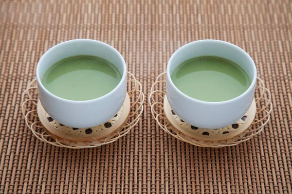 Hot green tea with milk matcha latte isolated on table — Stock Photo, Image