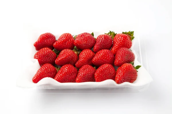 Packed strawberries fruits isolated on white background — Photo