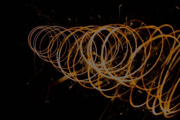 Spiral with sparks on a black background - Stock-foto