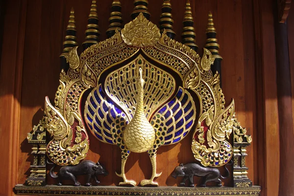 Golden peacock buddhist temple art — Stock Photo, Image