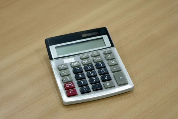 Calculator on wood tablecalculator on wood table — Stock Photo, Image