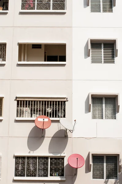 Satellite dishes on the residence apartment wall — Stock Photo, Image