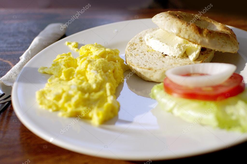 Breakfast, scramble egg cream cheese bagel — Stock Photo