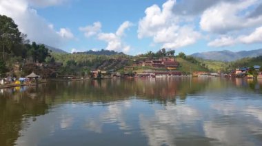 Pan view of Mae Hong Son, Thailand. Lake and resorts in Ruk Thai beautiful nature landscape travel destination slow motion