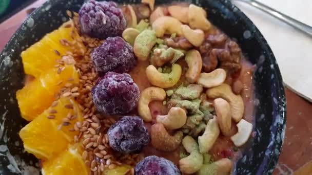 Healthy Vegan Bowl Smoothie Berries Fruits Orange Cashew Nut Kale — Stock Video
