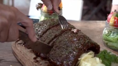 Hands Cutting Bbq Pork Ribs Cover In Sauce And Spices Rustic Yummy American Style Grill