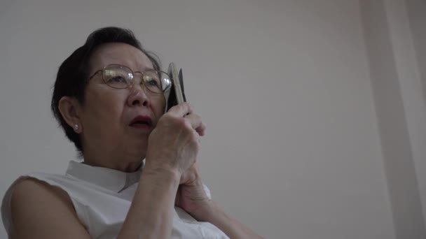 Asian Senior Woman Stress Scam Phone Call Worry Need Help — Video