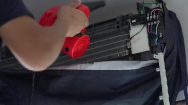 Techinician worker cleaning air conditioner blow dry after wash