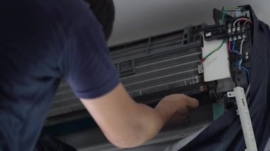 Techinician worker cleaning air conditioner blow dry after wash
