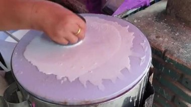 Banh cuon Vietnamese rice flour steamed paper with egg traditional local street food of Vietnam cooking process