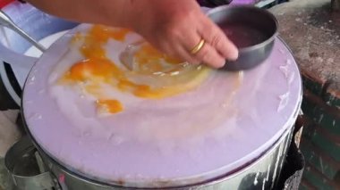 Banh cuon Vietnamese rice flour steamed paper with egg traditional local street food of Vietnam cooking process