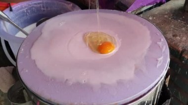Banh cuon Vietnamese rice flour steamed paper with egg traditional local street food of Vietnam cooking process
