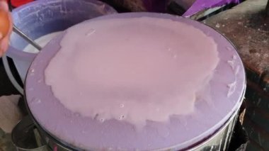 Banh cuon Vietnamese rice flour steamed paper with egg traditional local street food of Vietnam cooking process