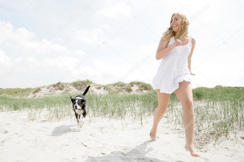 Young blonde woman with dog