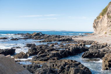 Rocks and pillow lava rock formation on the pacific ocean shore. Travel destination. Narooma, NSW, Australia
