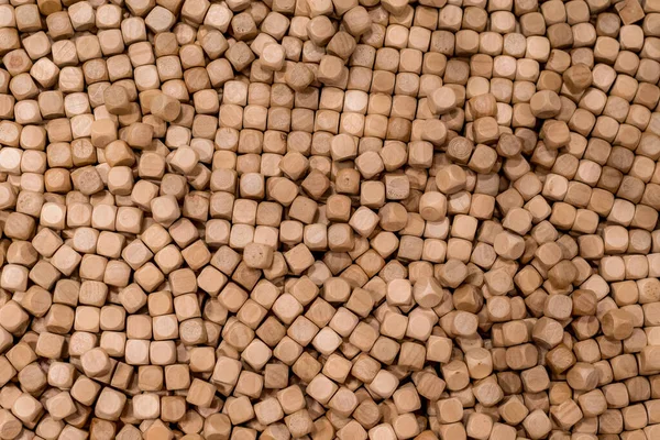 Hinoki cypress mini small wooden cubes chips for indoor sandpits sensory play playground. Wooden cubes background