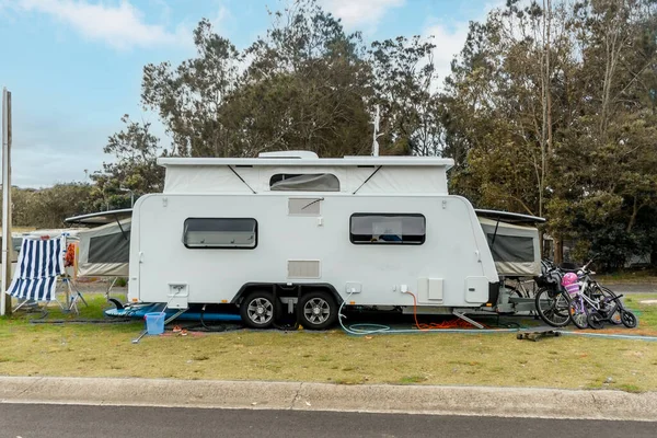 RV caravan camper on a camping site at holiday caravan park. famiy camping