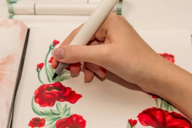 El çizimi kırmızı haşhaş çelengi çizimi. Çizim defterinde alkol bazlı çizim işaretleri var. Anma Günü ve Anzak Günü.