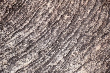 Kum taşı yüzeyi aşınmış kaya kayalığı doğal arkaplan dokusuna sahiptir.