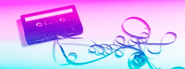 Old cassette tape in neon color. retro style. vintage music concept. — Stock Photo, Image