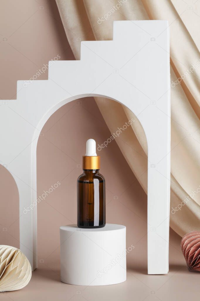 Serum essence on podium stage and geometric arches on beige background with textile and honeycomb paper decor. Skincare cosmetic in holiday concept