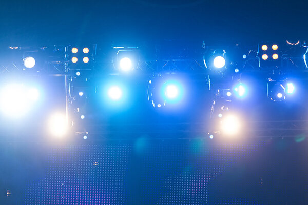 Defocused entertainment concert lighting on stage, bokeh.