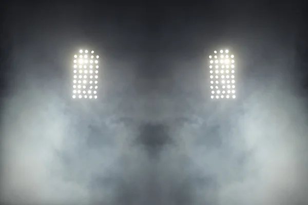 Огни стадиона на фоне тёмного ночного неба — стоковое фото