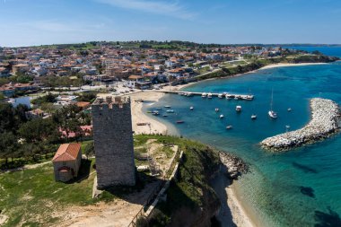 Aerial view of  byzantine tower and beach of village Nea Fokea in peninsula Kassandra Halkidiki Greece