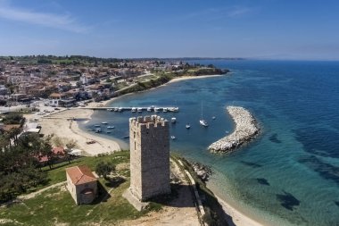 Aerial view of  byzantine tower and beach of village Nea Fokea in peninsula Kassandra Halkidiki Greece