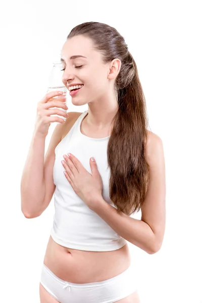 Chica feliz con botella de agua en el deporte contra un backgro blanco —  Fotos de Stock