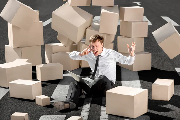 Crying and shocked businessman speaking phone and sitting with l — Stock Photo, Image