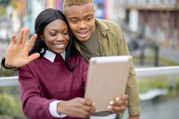 Black students having video call on digital tablet — Stock Photo, Image