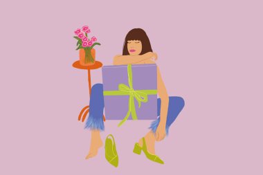 Tarz sahibi bir kadın arka planda büyük bir hediye kutusuyla rahatça oturuyor.