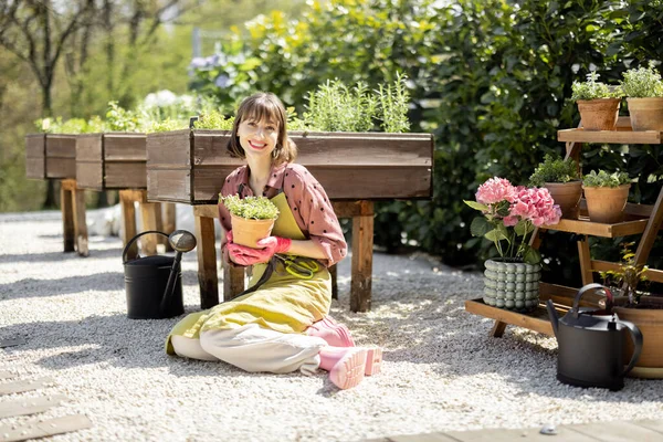 Portrait of young gardener at backyard — Photo