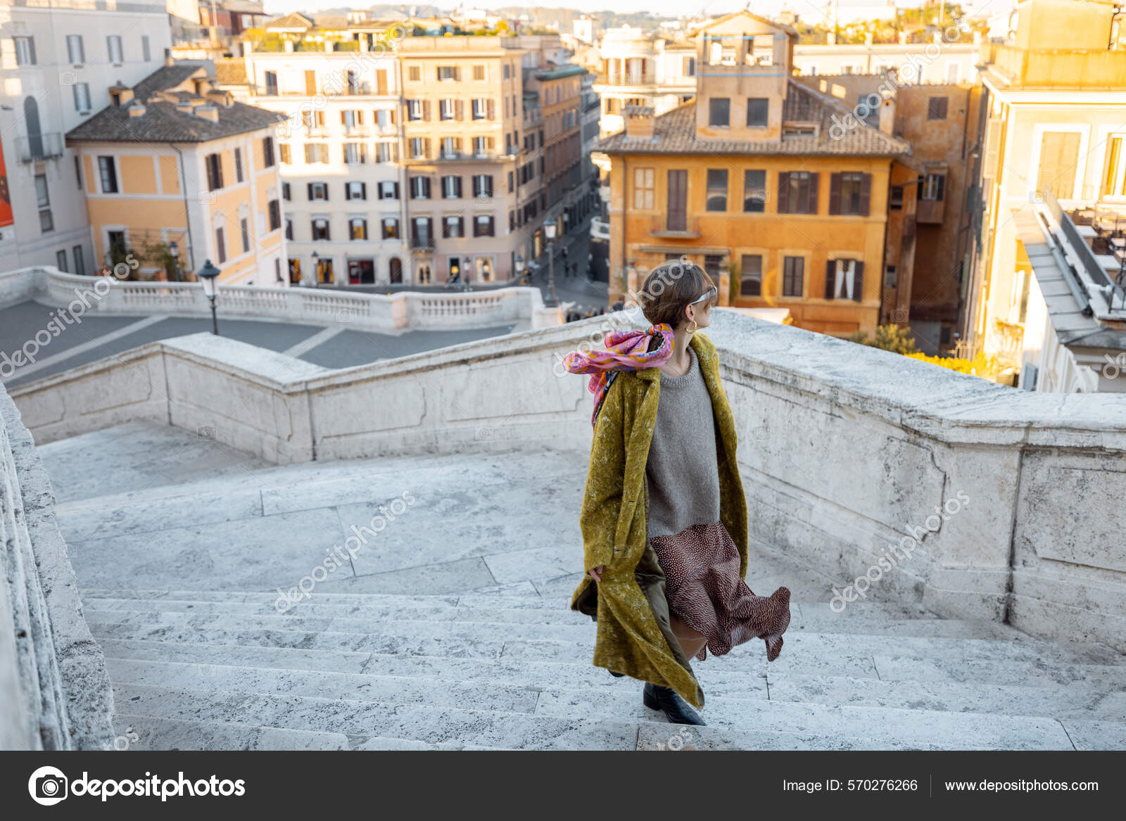 Woman running on famous Spanish steps on background of old town in Rome  Stock Photo by ©rossandhelen 570276266