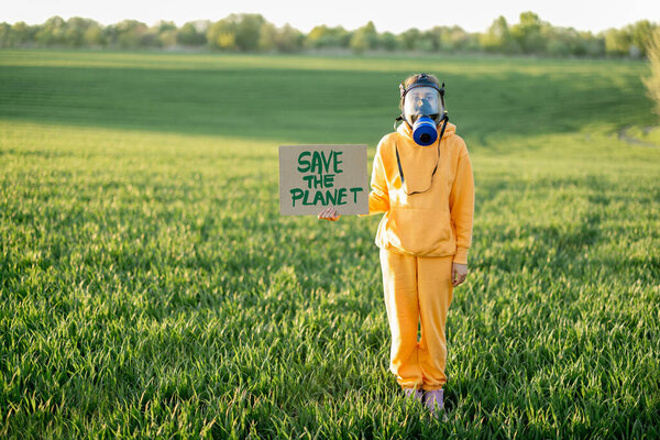 Person Overalls Gas Mask Holds Cardboard Call Planet While Standing Stock Image