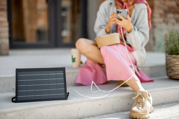 Person Use Smart Phone Charge Portable Solar Panel While Sitting — Foto de Stock