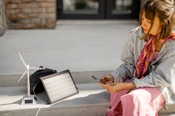 Young Stylish Woman Use Smart Phone Charge Portable Solar Panel — Stok Foto