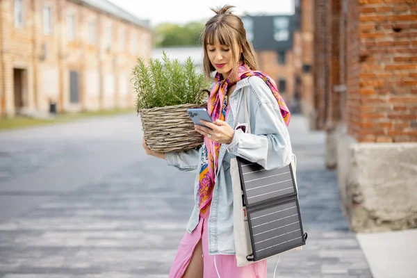 Young Stylish Woman Walks Green Plant Smart Phone Charging Portable — Foto de Stock