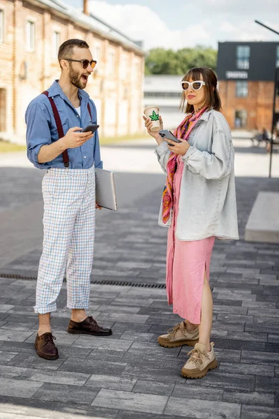 Young Stylish Couple Have Some Conversation While Standing Together Phones — 스톡 사진