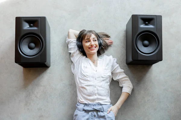 Young Excited Woman Listening Music Wireless Headphones Sound Speakers Lying — Stock Photo, Image