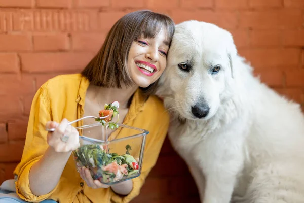 Portrait Young Cheerful Woman Sitting Her Cute White Dog Eating — 스톡 사진