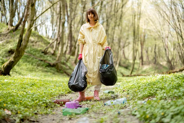 Young Woman Protective Clothes Stands Garbage Bags Collecting Scattered Plastic — Stok Foto