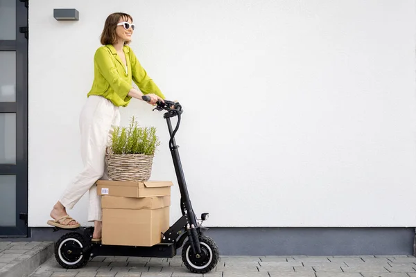 Young Happy Woman Driving Electric Scooter Carrying Cardboard Boxes White — Stock Photo, Image