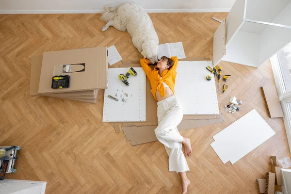 Young Woman Lies Floor Her Cute Dog Resting While Making — Stok Foto
