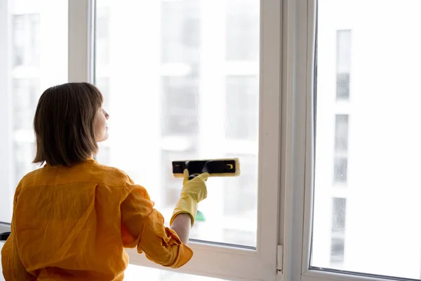 Young Housewife Cleaning Company Employee Washes Window Special Tool Apartment — стоковое фото