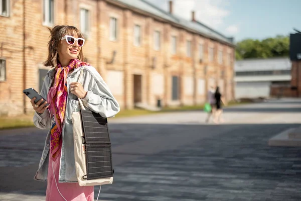 Young Stylish Woman Walks Smart Phone Charge Portable Solar Panel — Foto de Stock