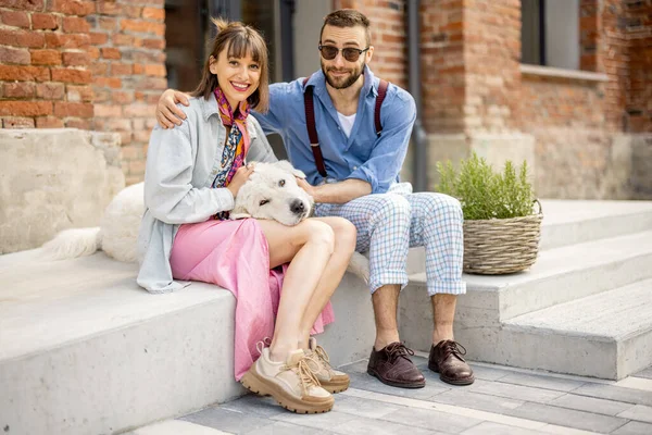 Young Stylish Couple Sit Together Have Fun White Dog Street — 图库照片