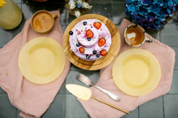 Beautiful Tiled Table Served Festive Berry Cheesecake Decorated Flowers View — Stock fotografie